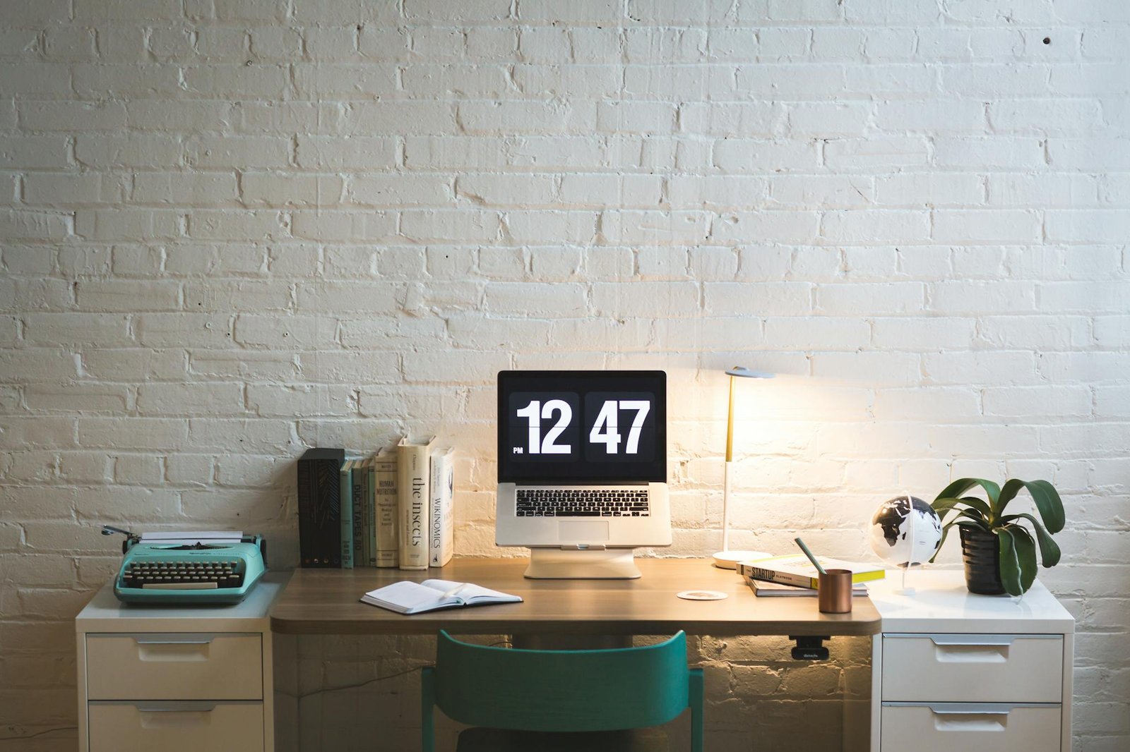 Elegant workspace featuring a computer on a sleek desk, ideal for work and creativity.